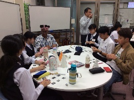 Making party hats to wear during the movie's celebration scene and dance before the presentation began.